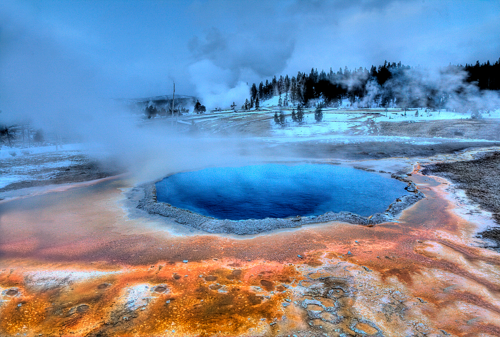 Crested,pool's,colors,shine,during,the,winter,at,yellowstone,national
